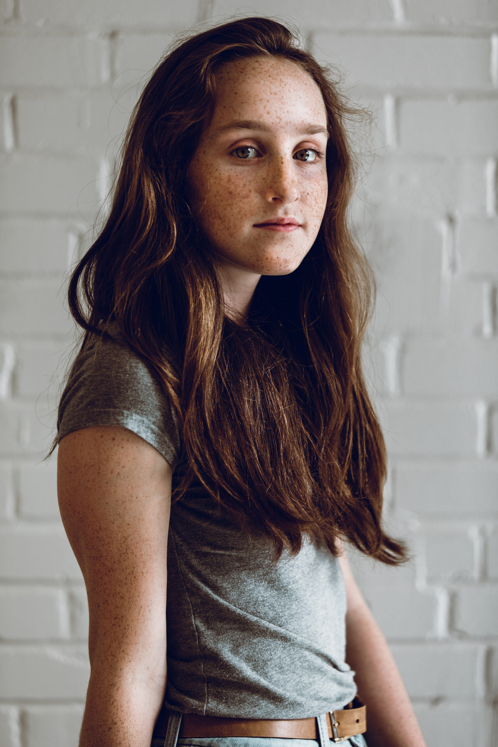 young female looking into camera with slight smile