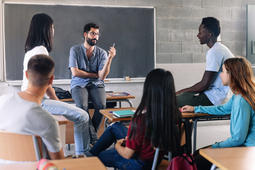 Teenager student class and young teacher sharing group discussion