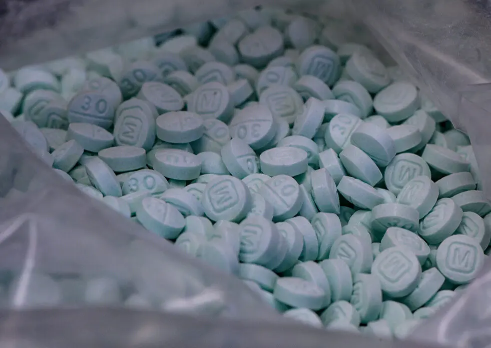 bag of light blue pills